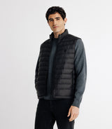 Sleeveless jacket with black upright collar