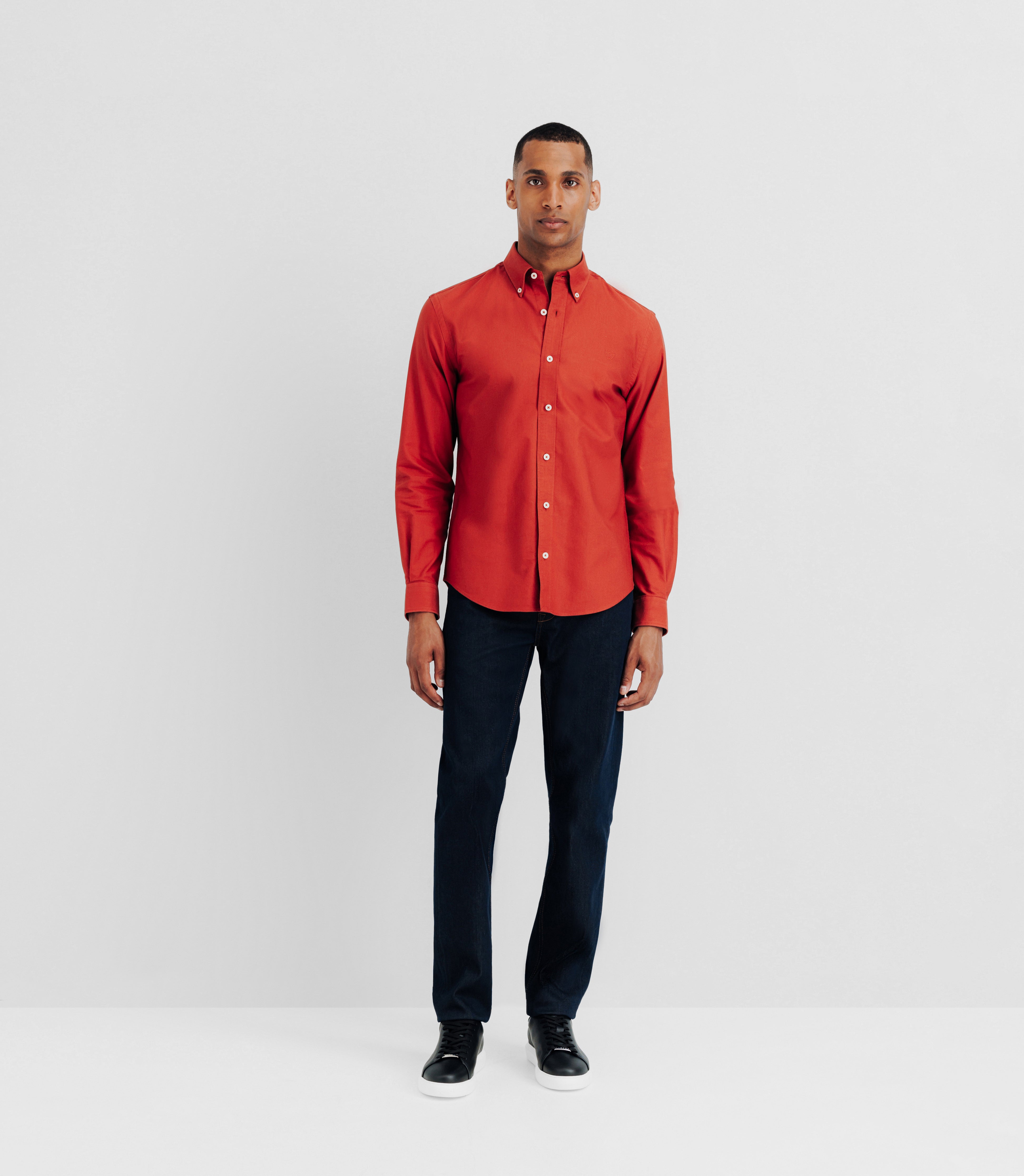 Shirt with orange buttoned collar