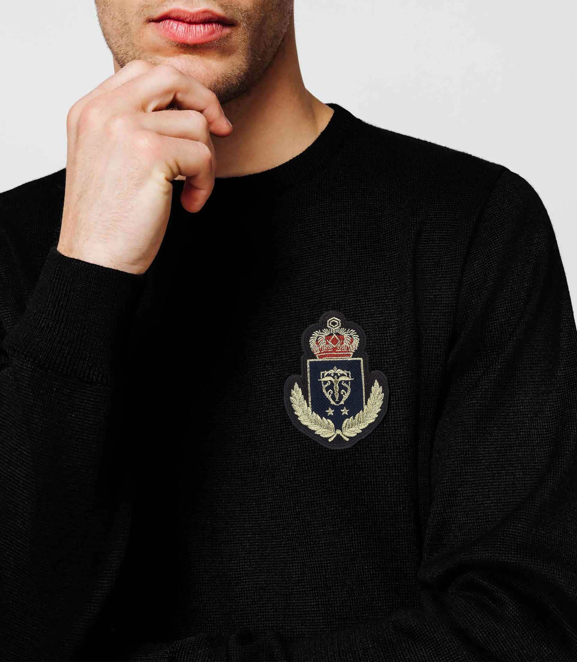 Black sweater chest blazon