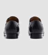 Elvio" couture black leather derby